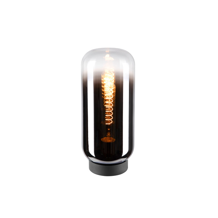 Glass table lamp with black base and exposed filament bulb.