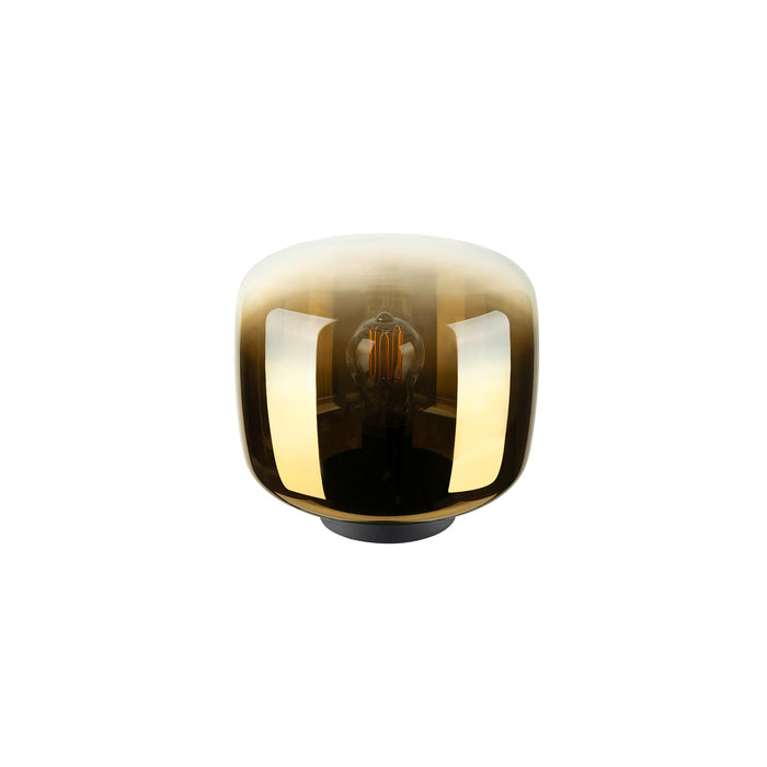Glass table lamp with a gold ombre finish and black base.
