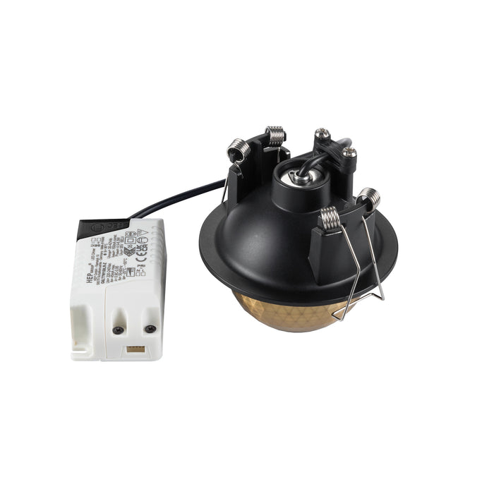 Recessed light fixture with black housing, gold reflector, and white driver box, spring-mounted.
