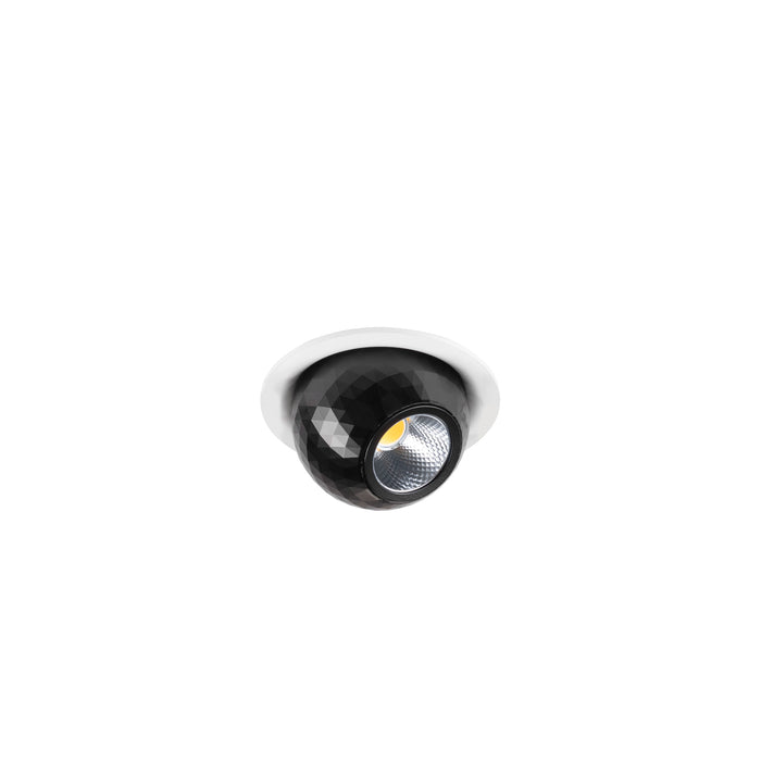 Recessed ceiling light fixture, black faceted finish, with white trim.