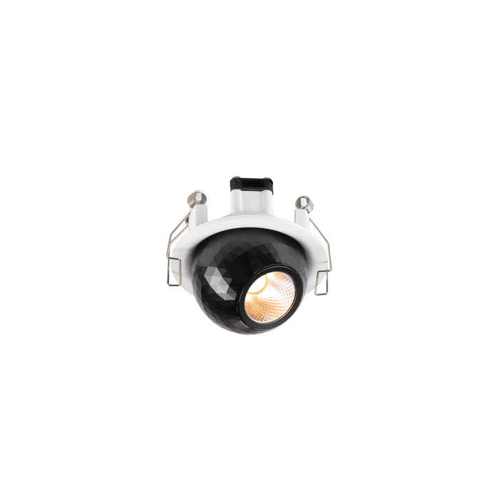 Recessed ceiling light fixture, black faceted shade, white trim, spring mounting.