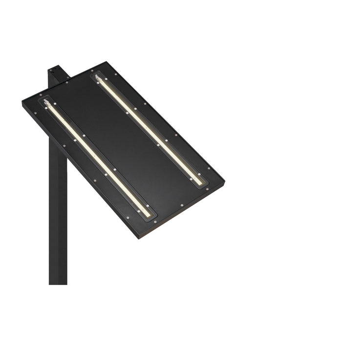 Black metal post-mounted LED area light fixture.