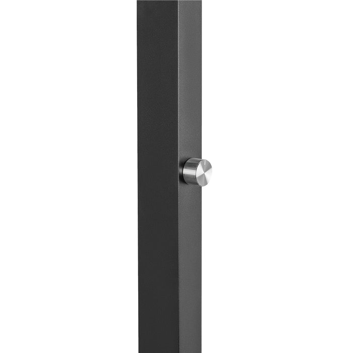 Close-up of a black metal post with a silver knob.