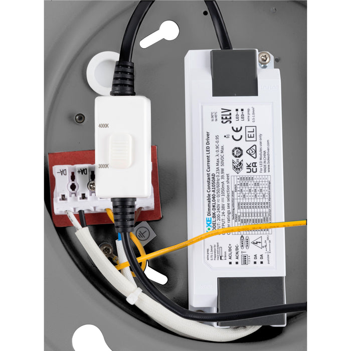 LED driver wiring detail, showing electrical components, connections, and gray metal mounting.