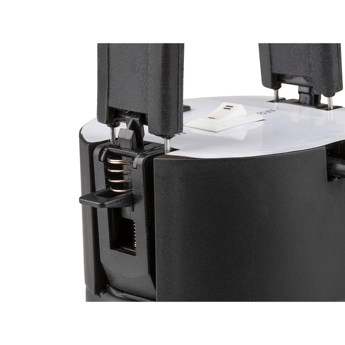 Black plastic device with a glossy white top, featuring a spring mechanism and mounting points for installation.
