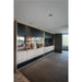 Built-in wine storage cabinet with light wood lower cabinets, black upper cabinets, and glass doors.