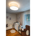 Fabric drum ceiling light, flush mount, in a neutral nursery.