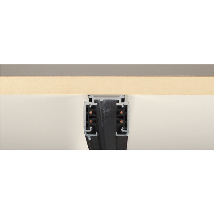 Recessed black aluminum track lighting rail, mounted on ceiling.
