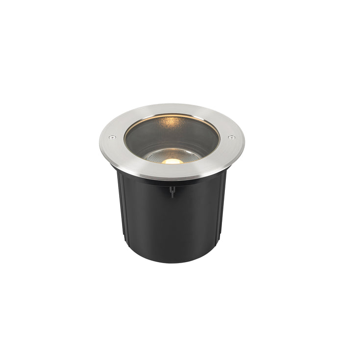 Stainless steel in-ground light fixture with a black housing.